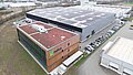 Aerial photo of the Novotegra company building in Tübingen, with integrated PV system